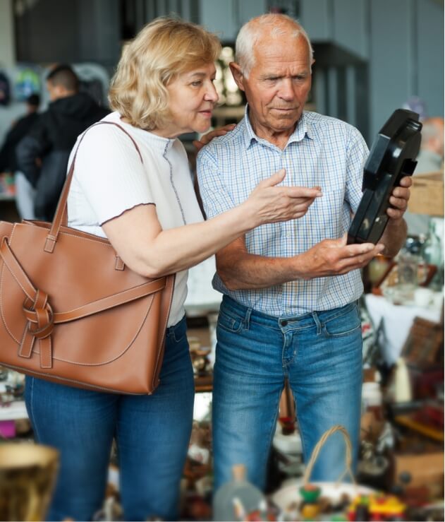 old man and woman looking things at local Estate Sales